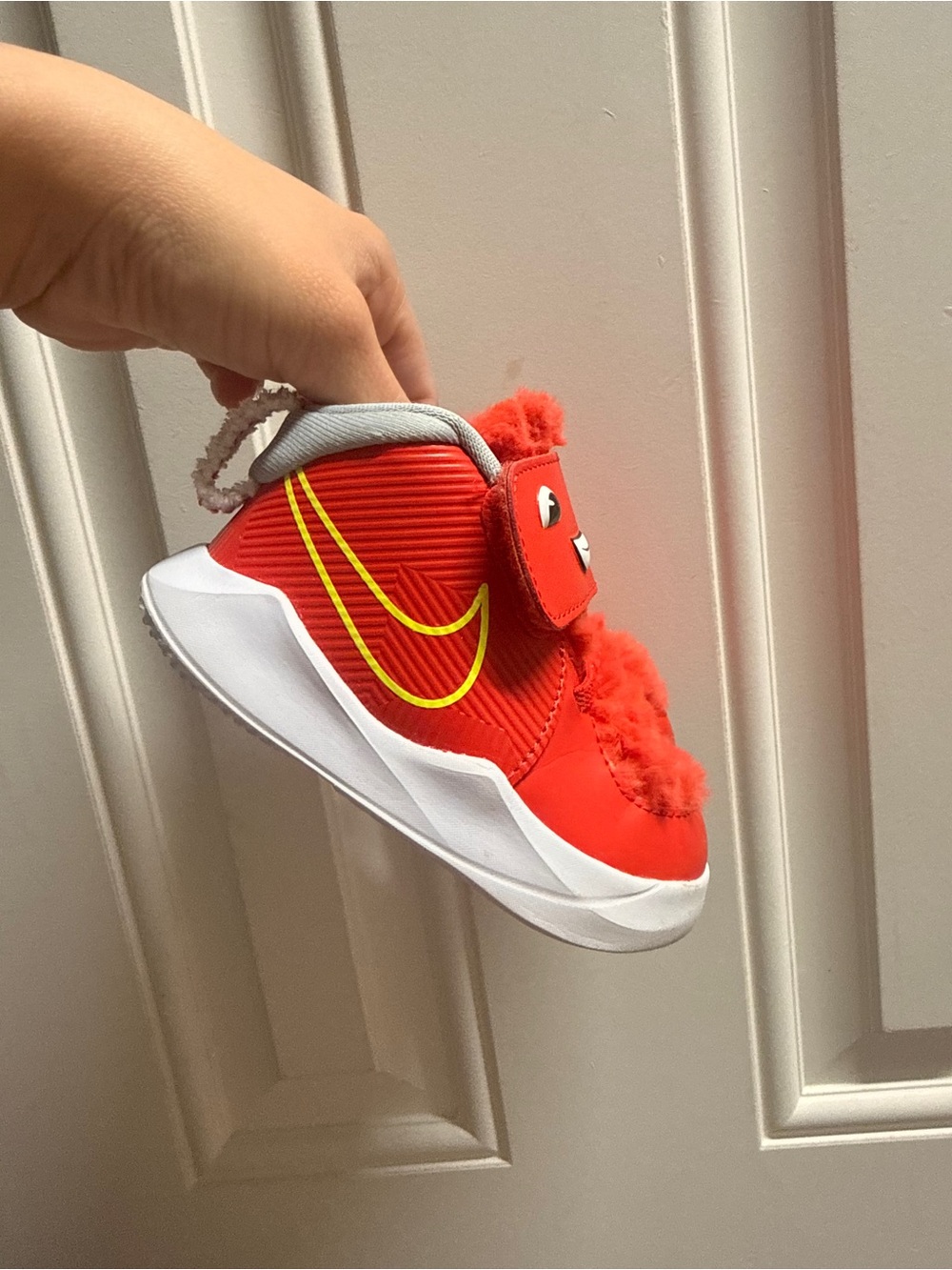 Nike Kids Red Sneakers with Yellow Swoosh and Fuzzy Trim